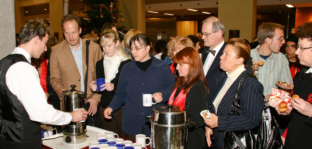 Guests enjoy a mug of mulled wine after the show